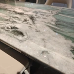 Green Veined Marble Dining Table with High-Gloss Dark Angled Pedestal and Stone Inlay Accents